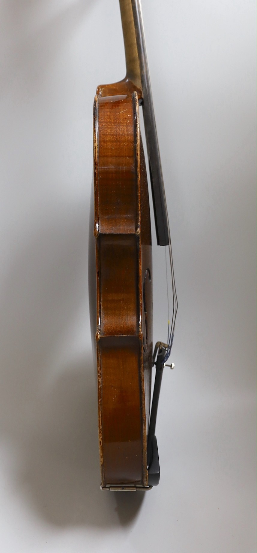 A Maidstone violin, with bow, cased. violin 59 cms high.